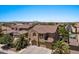 An aerial view showcases this well-maintained desert home with lush landscaping and a nearby community pool at 5060 S Clancy --, Mesa, AZ 85212