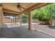 Back patio features a ceiling fan, supports and a view of the pool at 5060 S Clancy --, Mesa, AZ 85212