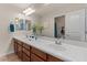 Bright bathroom featuring a double sink vanity with white countertop and updated fixtures at 5060 S Clancy --, Mesa, AZ 85212