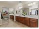 Well-lit bathroom boasts a dual sink vanity and mirrored closet at 5060 S Clancy --, Mesa, AZ 85212