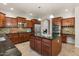 Gourmet kitchen boasts granite counters, stainless appliances, center island, and ample cabinet space at 5060 S Clancy --, Mesa, AZ 85212