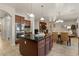 Gourmet kitchen boasts granite counters, stainless appliances, center island, and open floorplan at 5060 S Clancy --, Mesa, AZ 85212