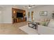 Cozy living room featuring a brick accent wall and backyard access at 5060 S Clancy --, Mesa, AZ 85212
