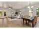 Bright living room features neutral tones, tile flooring, and access to the backyard at 5060 S Clancy --, Mesa, AZ 85212