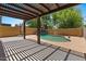 Backyard pool area includes a wooden pergola covering a portion of the patio at 5060 S Clancy --, Mesa, AZ 85212