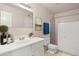 This bathroom features a shower and bathtub combo, a white vanity, and a decorative mirror, perfect for relaxation at 6625 N 44Th Ave, Glendale, AZ 85301