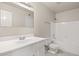 This bathroom features a bathtub, a white vanity, and a tiled floor, perfect for comfort and style at 6625 N 44Th Ave, Glendale, AZ 85301