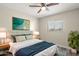This bedroom features a ceiling fan, an accent wall, and a large window that lets in plenty of natural light at 6625 N 44Th Ave, Glendale, AZ 85301