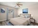 Digitally staged bedroom with an inviting bed, lamps, and soothing wall art at 6625 N 44Th Ave, Glendale, AZ 85301