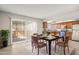 Open dining area with modern table set and access to the kitchen and outdoor space at 6625 N 44Th Ave, Glendale, AZ 85301