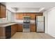 Functional kitchen with ample counter space, modern appliances and wood cabinetry at 6625 N 44Th Ave, Glendale, AZ 85301