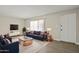 Comfortable living room featuring a modern sofa, stylish coffee table, and a television at 6625 N 44Th Ave, Glendale, AZ 85301