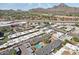 Scenic aerial view of a community with a pool, river, and mountain backdrop at 6739 N 16Th St # 17, Phoenix, AZ 85016