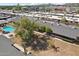 An aerial view showcases a neighborhood community with mature trees and a refreshing swimming pool at 6739 N 16Th St # 17, Phoenix, AZ 85016