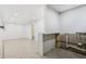 Spacious basement with tile flooring, ready for customization with utilities and plumbing partially exposed at 6739 N 16Th St # 17, Phoenix, AZ 85016