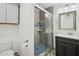 Nicely renovated bathroom featuring a glass shower door, designer tile, toilet, and stylish vanity at 6739 N 16Th St # 17, Phoenix, AZ 85016
