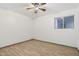 Bedroom with ceiling fan, wood-look flooring, and natural light at 6739 N 16Th St # 17, Phoenix, AZ 85016