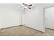 A simple bedroom features modern flooring and a ceiling fan for added comfort at 6739 N 16Th St # 17, Phoenix, AZ 85016