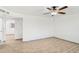 Bright bedroom featuring wood-look flooring, a ceiling fan, and a view into an adjoining room at 6739 N 16Th St # 17, Phoenix, AZ 85016