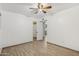 Bedroom with ceiling fan, wood-look flooring, and closet access at 6739 N 16Th St # 17, Phoenix, AZ 85016