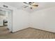Bedroom with ceiling fan, wood-look flooring, and entry to living space at 6739 N 16Th St # 17, Phoenix, AZ 85016