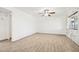 Spacious bedroom with wood-look flooring, ceiling fan, and a bright window providing natural light at 6739 N 16Th St # 17, Phoenix, AZ 85016
