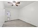Bedroom with a ceiling fan, exterior access, wood-look flooring, and natural light at 6739 N 16Th St # 17, Phoenix, AZ 85016