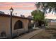 View of a single-story home with brick accents and mature desert landscaping at 6739 N 16Th St # 17, Phoenix, AZ 85016