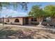 Charming single-story home featuring desert landscaping, brick accents and covered entry, set beneath a sunny sky at 6739 N 16Th St # 17, Phoenix, AZ 85016
