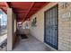 Inviting covered front porch with a secure entry door, brick accents, and a cozy, welcoming atmosphere at 6739 N 16Th St # 17, Phoenix, AZ 85016