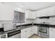 Kitchen featuring stainless steel appliances, black granite countertops, and modern cabinets at 6739 N 16Th St # 17, Phoenix, AZ 85016