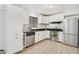 Bright kitchen with white cabinets, stainless steel appliances, and modern countertops at 6739 N 16Th St # 17, Phoenix, AZ 85016