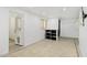 A versatile basement living area features tile floors, built-in shelving, and easy access to outside at 6739 N 16Th St # 17, Phoenix, AZ 85016