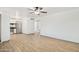 Open-concept living space featuring wood-look flooring and stainless steel appliances, ideal for entertaining at 6739 N 16Th St # 17, Phoenix, AZ 85016