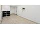A clean and bright basement living area with tile floors, built-in shelving, and convenient hook-ups at 6739 N 16Th St # 17, Phoenix, AZ 85016