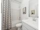 Modern bathroom featuring a combination tub and shower and a stylish vanity with a white countertop at 7435 S 76Th Dr, Laveen, AZ 85339