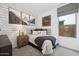 Comfortable bedroom showcasing patterned wallpaper, a gray window shade, and a cozy bed at 7435 S 76Th Dr, Laveen, AZ 85339