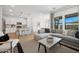Open-concept living room that seamlessly connects to a modern kitchen and dining area at 7435 S 76Th Dr, Laveen, AZ 85339