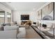 Spacious and well-lit living room with contemporary furnishings and decor at 7435 S 76Th Dr, Laveen, AZ 85339