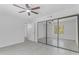 Bedroom featuring tiled floor, a large window, and a mirrored closet for ample storage at 7777 E Main St # 215, Scottsdale, AZ 85251