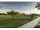 Picturesque view of the golf course with mature trees on a clear day at 7777 E Main St # 215, Scottsdale, AZ 85251