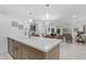 Open kitchen with stainless steel appliances, a center island, and a view of the living area at 7777 E Main St # 215, Scottsdale, AZ 85251