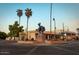 A statue of a cowboy riding a horse in the middle of a Scottsdale roundabout at 7777 E Main St # 215, Scottsdale, AZ 85251