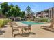 Inviting community pool with sun loungers and tables for relaxing and socializing at 7777 E Main St # 215, Scottsdale, AZ 85251
