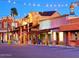 Festive street scene at dusk with lights and colorful buildings in Old Town Scottsdale at 7777 E Main St # 215, Scottsdale, AZ 85251