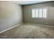Bedroom featuring carpeted floors and a bright window at 8330 N 22Nd Ln, Phoenix, AZ 85021