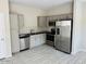 A modern kitchen with stainless steel appliances and ample cabinet space at 8330 N 22Nd Ln, Phoenix, AZ 85021