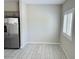 Eat in kitchen featuring tile floors with stainless steel refrigerator and a window at 8330 N 22Nd Ln, Phoenix, AZ 85021