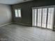 Living room featuring tiled flooring and a sliding glass door at 8330 N 22Nd Ln, Phoenix, AZ 85021