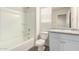 Bathroom includes a white vanity, and a shower over bathtub at 840 E Agua Fria Ln, Avondale, AZ 85323